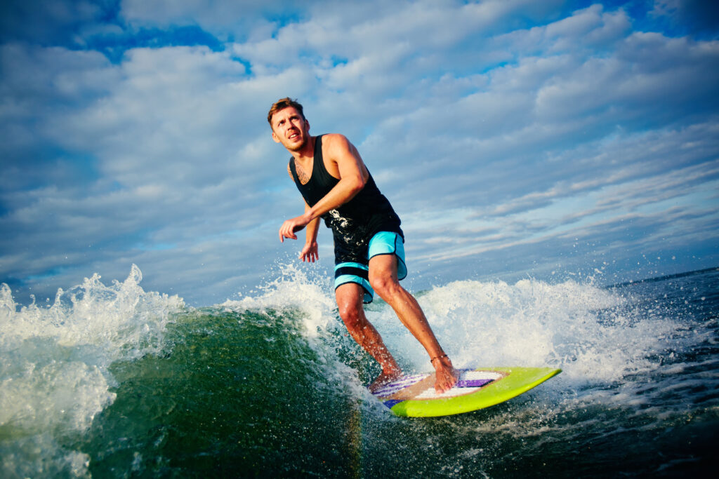Guests surfing the wave pool at The Point Surf Park in Fellsmere, Florida